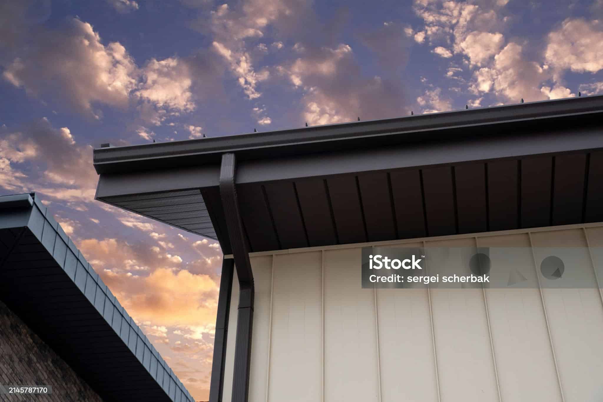 Brown Square Metal Rain Gutter System At Sunset